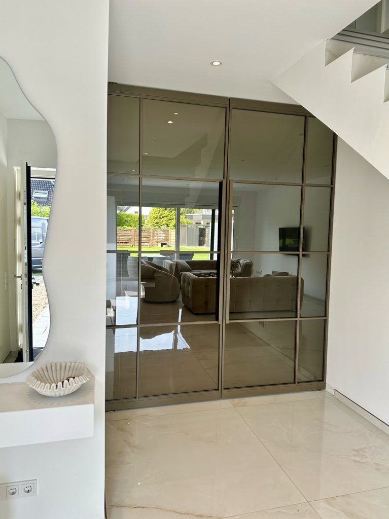 Doppelte Pivot-Lofttür mit braunem Glas und anodic bronze Finish